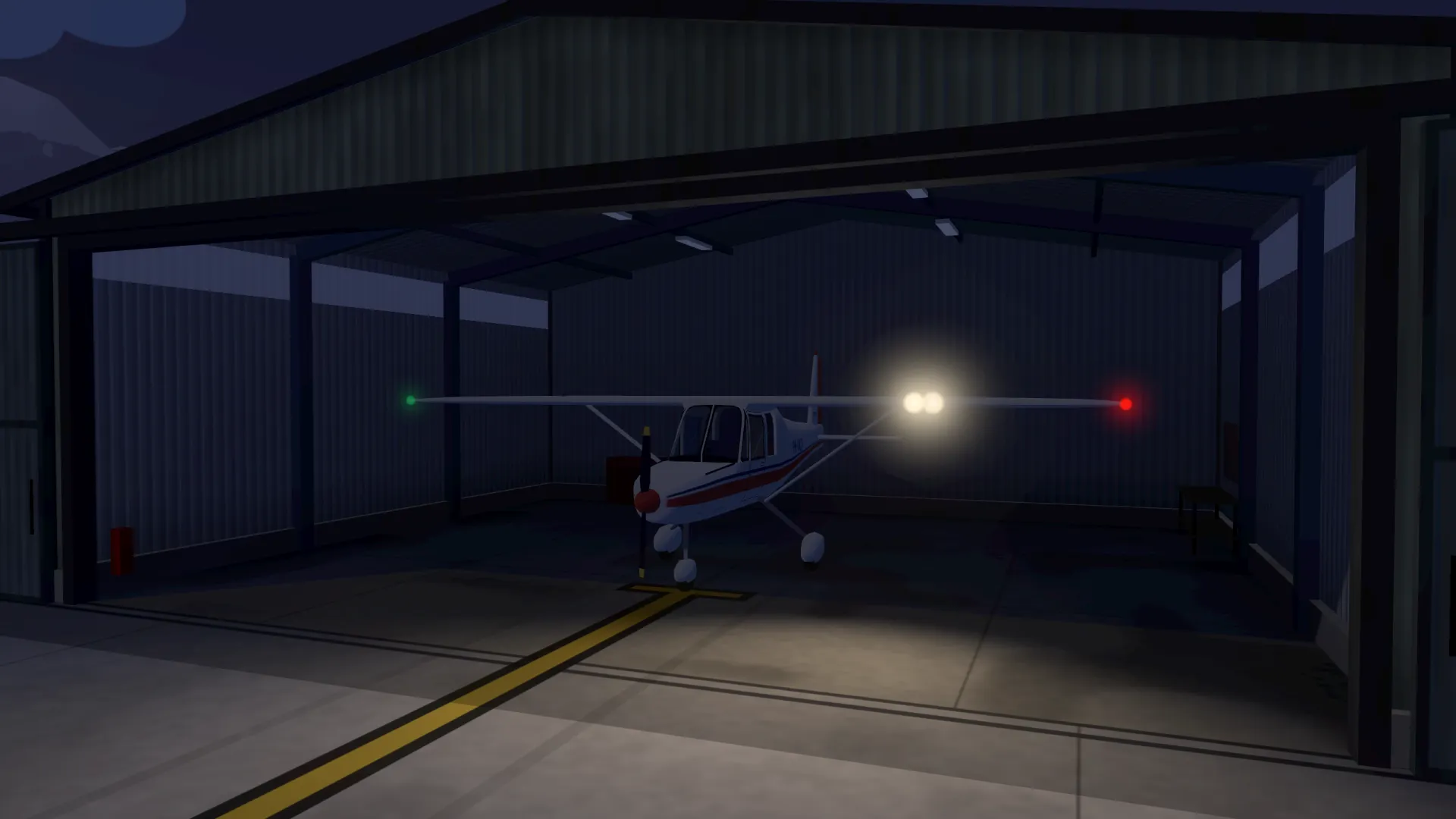 The plane in its hangar after sunset