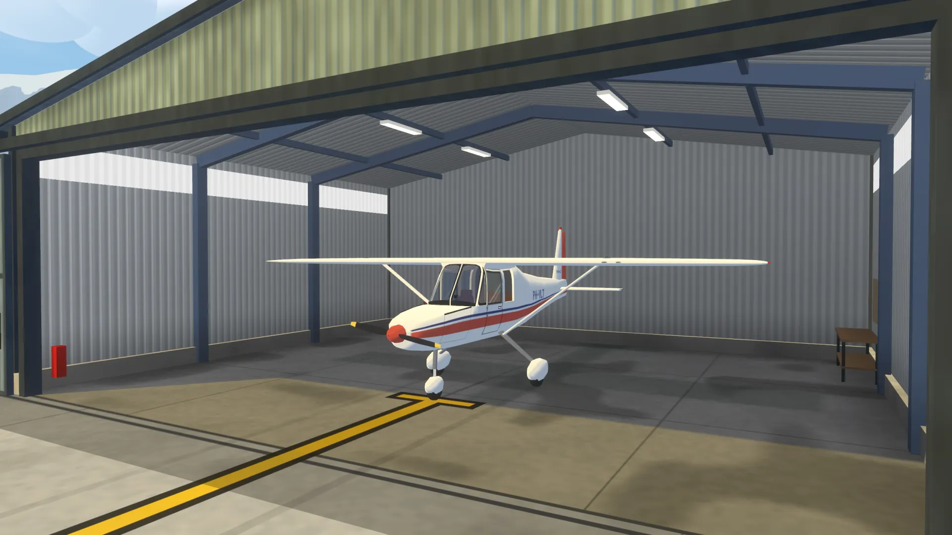The plane parked in an open hangar in the morning
